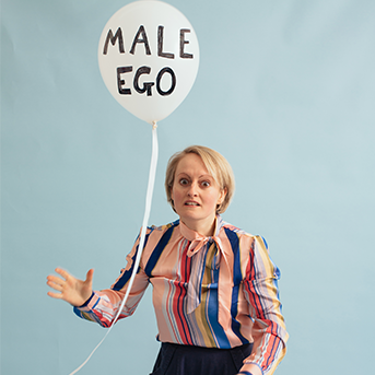 Jordan Skinner_a brief history of the fragile male ego poster of woman holding a ballon with the words Male Ego written on it